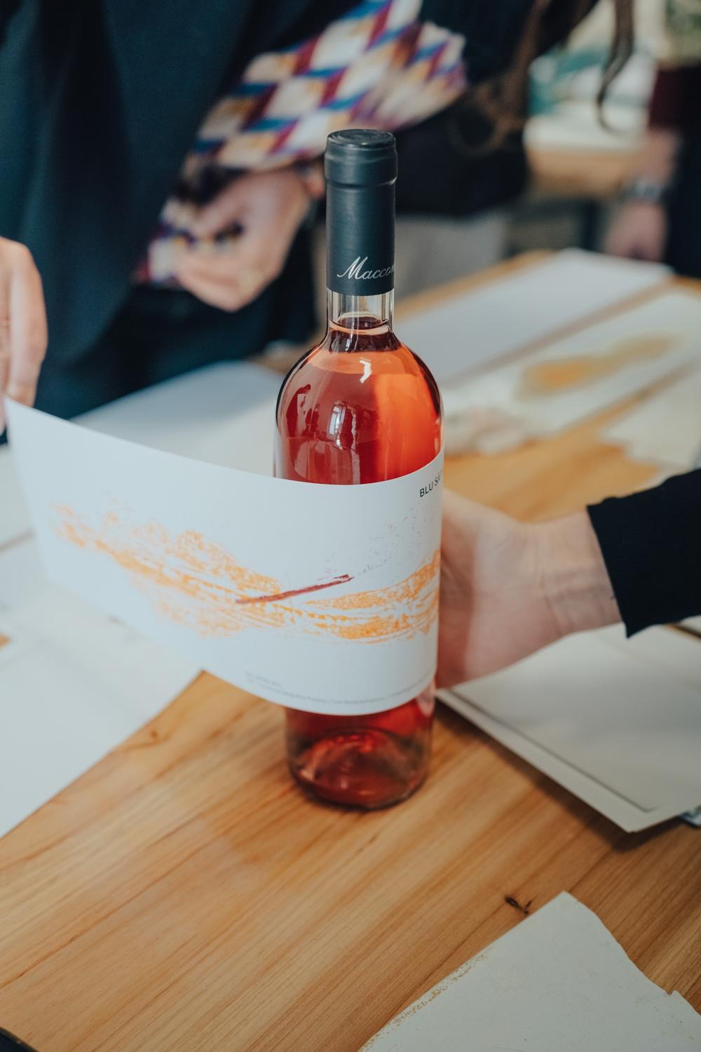 A label printed in orange, wrapped round the bottle A label printed in orange, wrapped round the bottle