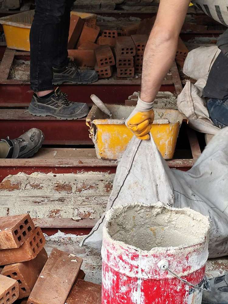 Lifting a sack of mortar, building site in Istanbul