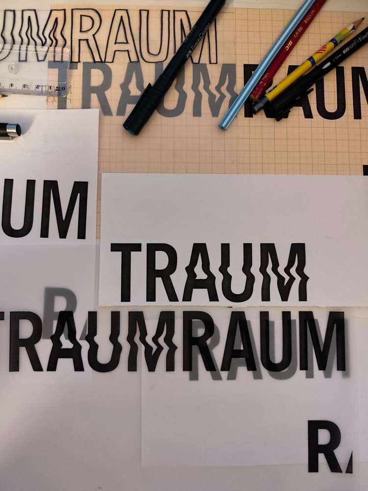 TRAUMRAUM wordmark, sketches and tracing paper, 2025